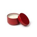 Vela aromática floral en recipiente metálico