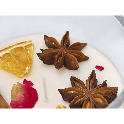 Vela con aroma a canela y cítricos