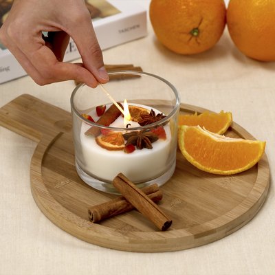 Vela con aroma a canela y cítricos