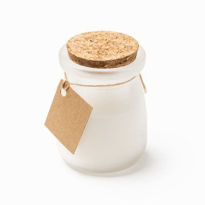 Vela aromática en cristal con tapón y tarjeta kraft