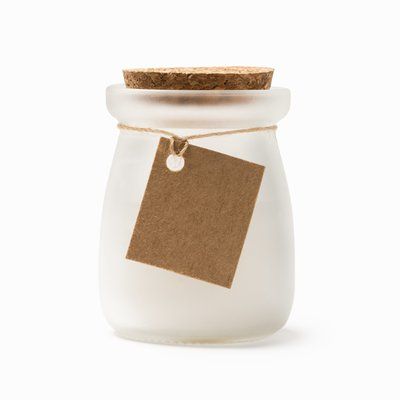 Vela aromática en cristal con tapón y tarjeta kraft