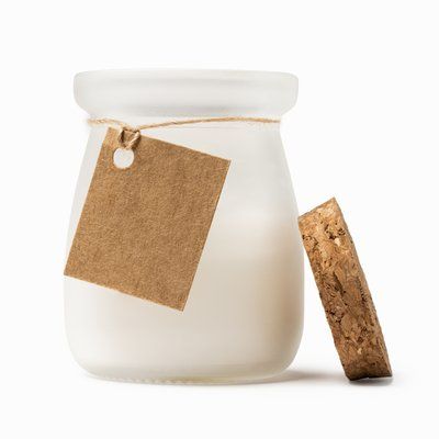Vela aromática en cristal con tapón y tarjeta kraft