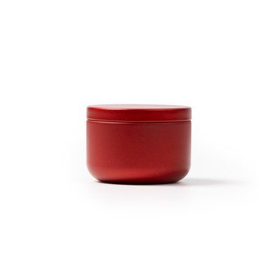 Vela aromática floral en recipiente metálico Rojo